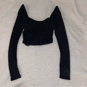Black long sleeved crop top. All mesh except for boob part!